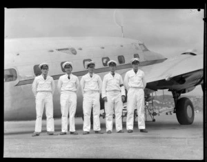 Boarding staff lined up outside aircraft Kawatere, New Zealand National Air Corporation