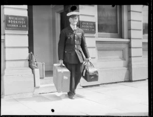 Commissionaire carrying baggage from office, Wellington NZNAC (New Zealand National Air Corporation)