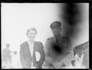 Mr J Baragwanath and his wife, prior to his departure to the United Kingdom in a Dakota aeroplane, to represent New Zealand, at RNZAF Station, Whenuapai, Auckland