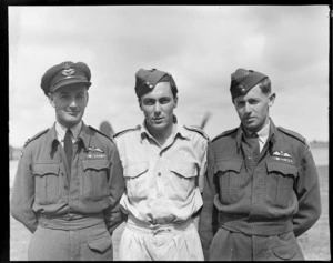 RNZAF group at Ohakea, Whanganui District, showing (L to R), Flight Lieutenant H D Coppersmith, Flight Sargeant J D Waugh and Flying Officer C J Berryman
