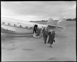 Unidentified passengers disembarking from a NZNAC (New Zealand Airways Corporation) aircraft from Auckland, Palmerston North