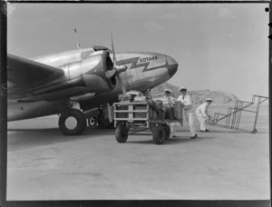 Royal New Zealand Aero Club, loading luggage on to Lodestar "Kotare" aircraft, Palmerston North