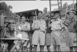 Officials shelter from rain at 4 NZ Armoured Brigade sports meeting in Isola del Liri, Italy, World War II - Photograph taken by George Kaye