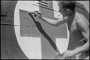 A E Wilcox repainting the Red Cross sign on his ambulance near Arce, Italy, World War II - Photograph taken by George Kaye