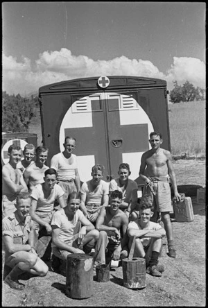 Some of the drivers and orderlies of a NZ ambulance unit painting their ambulances near Arce, Italy, World War II - Photograph taken by George Kaye
