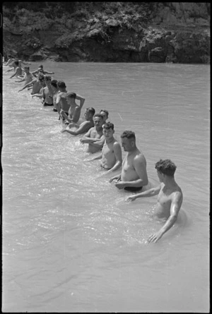 Competitors line up for start of the 'Mepacrine Marathon' at 24 NZ Battalion swimming sports at Arce, Italy, World War II - Photograph taken by George Kaye