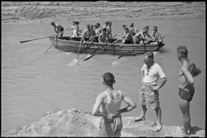 Boat crew sets out for starting point in race at 24 NZ Battalion's swimming and boating carnival at Arce, Italy, World War II - Photograph taken by George Kaye