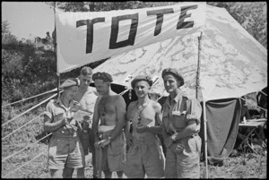 Trying to pick winners before visiting tote at 24 NZ Battalion's aquatic carnival at Arce, Italy, World War II - Photograph taken by George Kaye