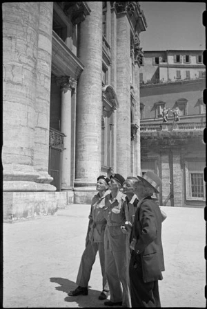 Guide pointing out features of St Peter's Basilica to World War II New Zealand soldiers on leave in Rome, Italy - Photograph taken by George Kaye