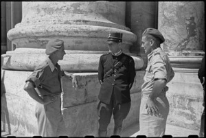 J B Savage and G A Sutherland chat with a Vatican City guard while on leave in Rome, Italy, World War II - Photograph taken by George Kaye