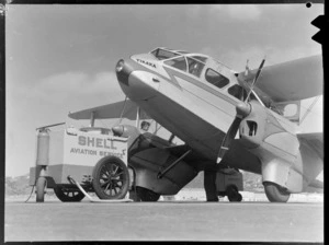 New Zealand National Airways Corporation de Havilland Dragon Rapide aeroplane 'Tikaka', being refueled at Rongotai Airport, Wellington