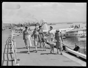 Unidentified passengers and crew disembarking from the TEAL Short Tasman class Sunderland Flying Boat ZK-AME at Mechanic's Bay, Auckland City