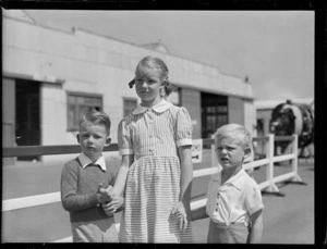 Group of unidentified children, [models for a Tasman Empire Airways Ltd advertising campaign?], at Mechanics Bay, Auckland