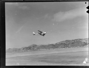 New Zealand National Airways Corporation De Havilland Dragon Rapide aeroplane, ZK-AKS, taking off from Rongotai Airport, Wellington