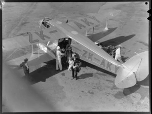 Passengers disembarking a New Zealand National Airways Corporation Dragon Rapide, ZK-AKY, at Rongotai Airport, Wellington