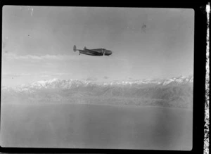 New Zealand National Airways Corporation Lockheed Lodestar aeroplane, in flight over Wellington Harbour