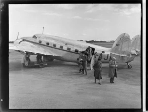 Passengers disembarking a New Zealand National Airways Corporation Lockheed Lodestar aeroplane at Palmerston North Airport