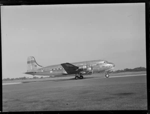 View of PAA NC-88948 'Clipper Westward Ho' passenger plane on the runway, Whenuapai Airfield, Auckland