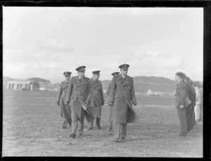 Sir Ralph Cochrane and Sir Leonard Isitt, with three unidentified officers inspecting a line up of Royal New Zealand Air Force cadets, Whenuapai Airbase, Auckland