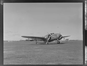 NZNAC (New Zealand National Airways Corporation) Lockheed Lodestar ZK-AIQ aeroplane 'Kotuku', Mangere Airport, Auckland, including a Tiger Moth ZK-AHZ airplane in the background