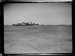 NZNAC (New Zealand National Airways Corporation) Lockheed Electra ZK-ALH 'Kopeke' aeroplane in mid flight, Mangere airport, Auckland