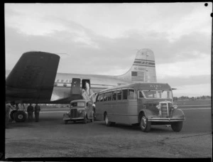Johnston's Bus Service meeting, PAA (Pan American Airways) Clipper NC88883 at unidentified airport