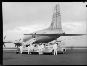 PAWA (Pan American World Airways) traffic staff vehicles in front of a Clipper NC88883