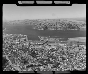 Downtown Dunedin City with railway yards and wharves, looking to Dunedin Harbour and the suburb of Waverley beyond