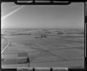 View over crop fields surrounding a farm on the Canterbury Plains, Ashburton District, Canterbury Region
