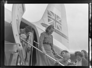 View of unidentified people inspecting the visiting British Vickers Viking passenger plane G-AJJN at Paraparaumu Airfield, Wellington Region