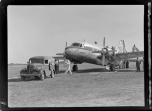 Visiting British Vickers Viking passenger plane G-AJJN being refuelled from a Shell Oil truck by unidentified men at Paraparaumu Airfield, Wellington Region
