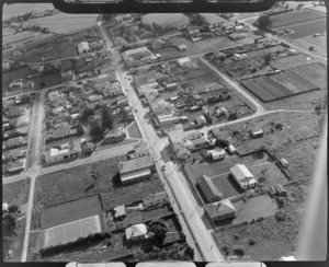 The town of Otaki with the Ford Service garage on Main Street and houses surrounded by field crops and farmland, Kapiti Coast, Wellington Region