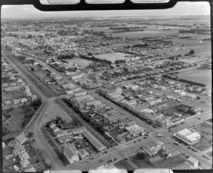 The town of Levin and Queens Street with the Dominion Motors garage in foreground, with Oxford Street through town and the Weraroa Reserve beyond, Manawatu-Whanganui Region