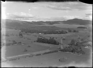Farms and pine forest plantation covered hills, Rotorua District