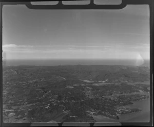 View north east to the Auckland City Council Waitakere Ranges watershed area with the settlement of Laingholm on the Manukau Harbour in the foreground, Auckland City