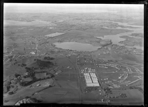Passenger Transport Company coverage over the suburb of Panmure with an unidentified factory, Mount Wellington Domain and the Panmure Basin, looking to East Tamaki, Auckland City