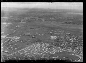 Passenger Transport Company coverage over an unidentified suburb with factories and housing with a tidal estuary area beyond, Auckland City