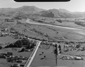 View of the rural town of Ruatoria looking south with Mangaharei Street in the foreground intersecting Waiomatatini Road and the Waiapu River beyond, Gisborne Region