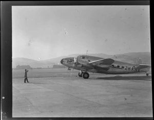 View of NZ NAC (National Airways Corporation) Lodestar 'Karoro' KZ-AHX passenger plane taxiing on Dunedin Airport runway, Otago Region