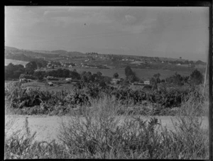 Stanmore Bay, Whangaparaoa, Auckland, showing a road, looking towards township