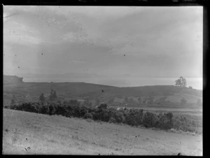 Stanmore Bay, Whangaparaoa, Auckland, including grassy area, view of a rooftop, looking out to the bay