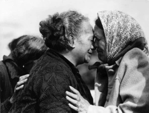Two women at the Otaki Church centennial, greeting each other with a hongi