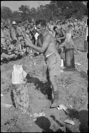 W I M Baker winning the wood chopping event at 5 NZ Field Regiment Gymkhana, Arce, Italy, World War II - Photograph taken by George Bull