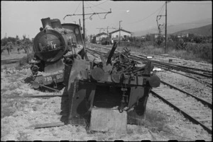 Wrecked railway engine and wagon in station yard at Terontola, Italy, World War II - Photograph taken by George Kaye