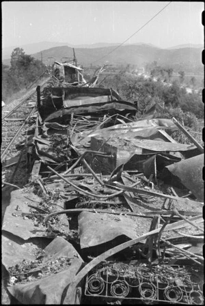 Wrecked railway train left by retreating German troops in the Terontola Station, Italy, World War II - Photograph taken by George Kaye