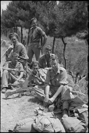 Members of 26 New Zealand Battalion who took part in World War II battle for Lignano, Italy, awaiting transport to rear - Photograph taken by George Kaye