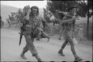 Members of 26 New Zealand Battalion on way out from front line after assault on Mt Lignano, Italy - Photograph taken by George Kaye