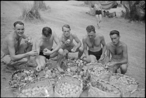 New Zealanders sample peaches and apricots at Divisional HQ picnic at Lake Albano near Rome, Italy - Photograph taken by George Kaye