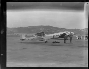 Auster ZK-ALW airplane, Rongotai airport, Wellington, including two unidentified men standing nearby