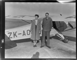 Miss Hunter and an unidentified man, in front of an Auster ZK-AOB airplane, Timaru